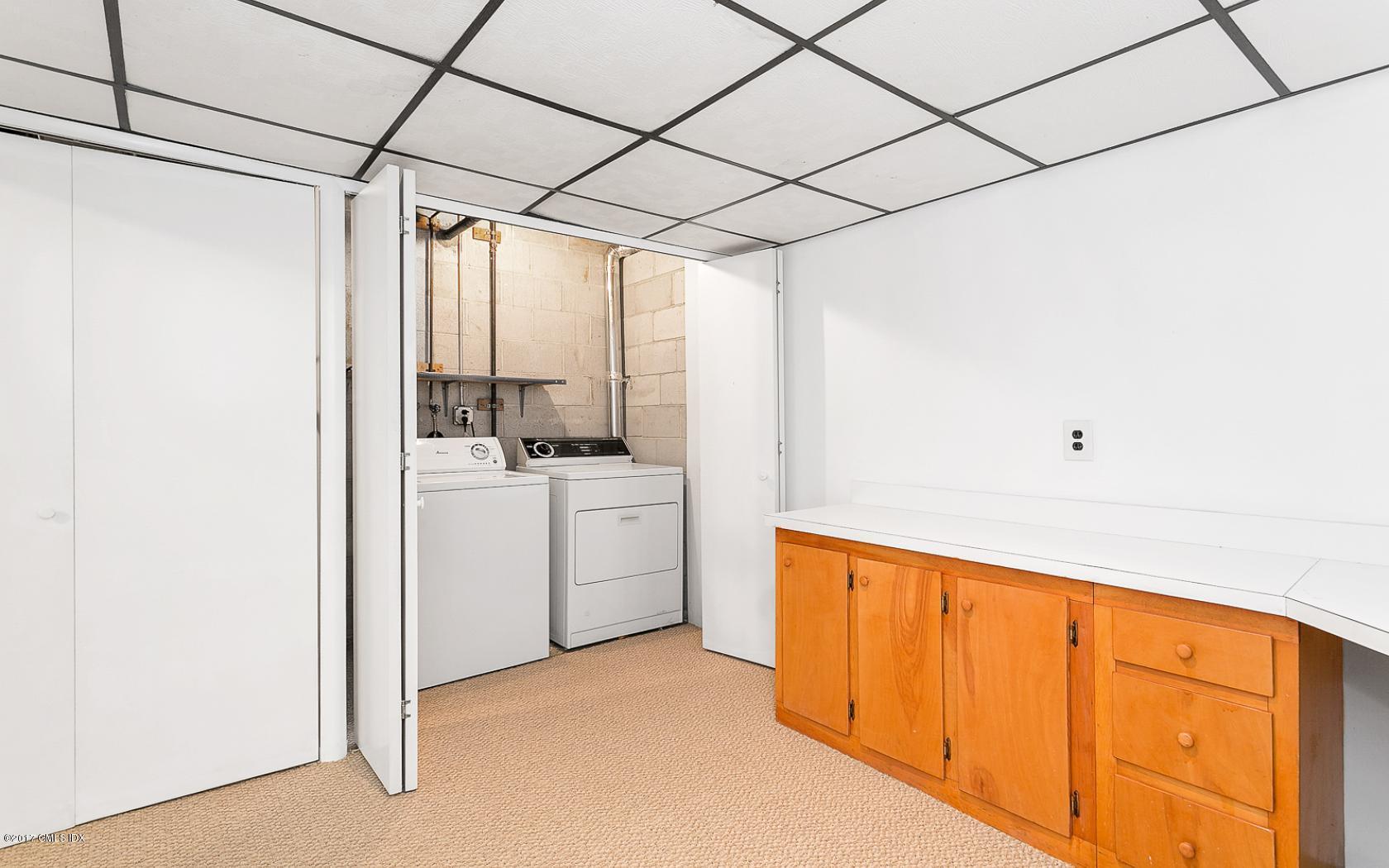 24 Whiffletree Way, Unit 24 Riverside, CT 06878 - Photo 24 of 29 a view of storage and utility room with washer and dryer