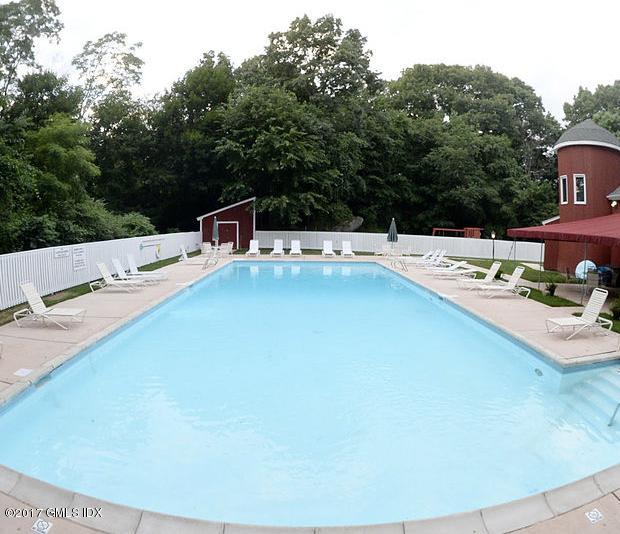 24 Whiffletree Way, Unit 24 Riverside, CT 06878 - Photo 3 of 29 a terrace with a table and chairs