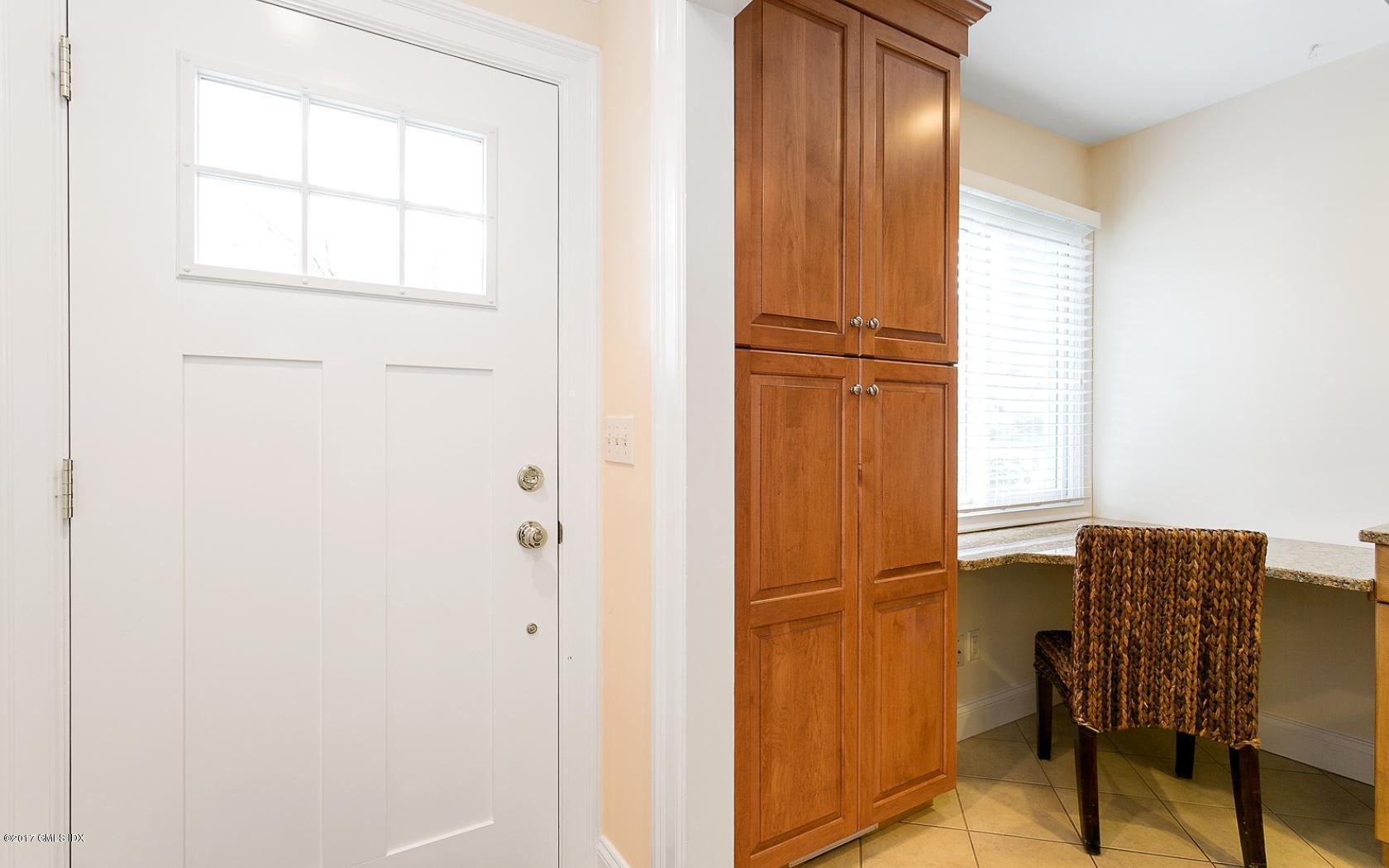 24 Whiffletree Way, Unit 24 Riverside, CT 06878 - Photo 7 of 29 a view of a livingroom with furniture and windows