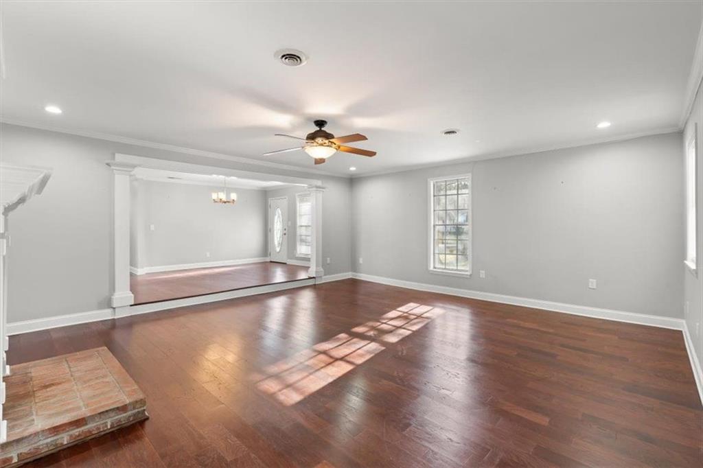 81 Russell Drive Northeast Rome, GA 30165 - Photo 11 of 38 a view of an empty room with window and wooden floor