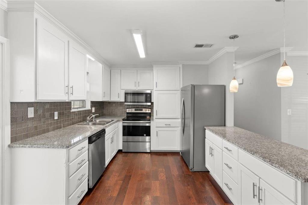 81 Russell Drive Northeast Rome, GA 30165 - Photo 15 of 38 a white kitchen with granite countertop a sink a counter top space stainless steel appliances and cabinets