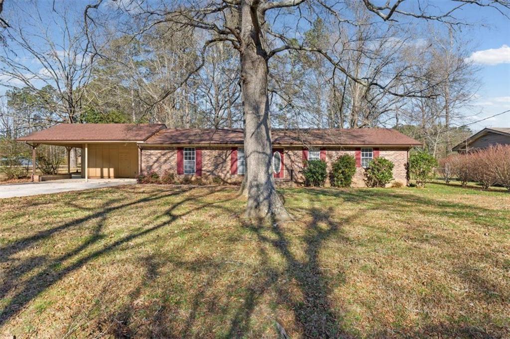 81 Russell Drive Northeast Rome, GA 30165 - Photo 2 of 38 a view of a house with a yard
