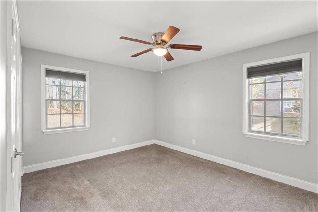 81 Russell Drive Northeast Rome, GA 30165 - Photo 21 of 38 an empty room with windows and fan