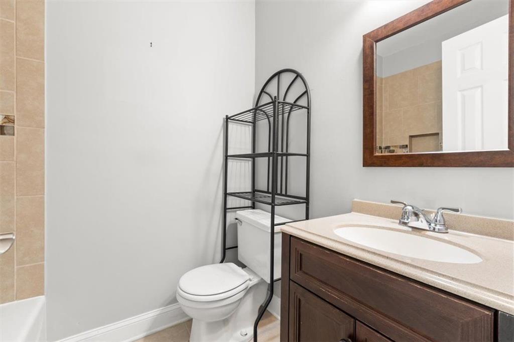 81 Russell Drive Northeast Rome, GA 30165 - Photo 26 of 38 a bathroom with a sink toilet and a mirror