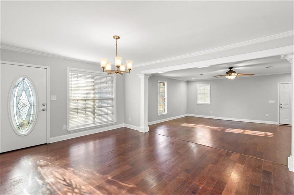 81 Russell Drive Northeast Rome, GA 30165 - Photo 6 of 38 a view of an empty room with wooden floor and a window