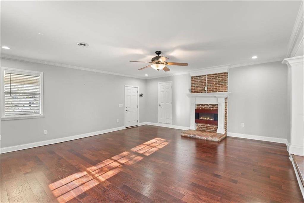81 Russell Drive Northeast Rome, GA 30165 - Photo 9 of 38 wooden floor in an empty room with a window