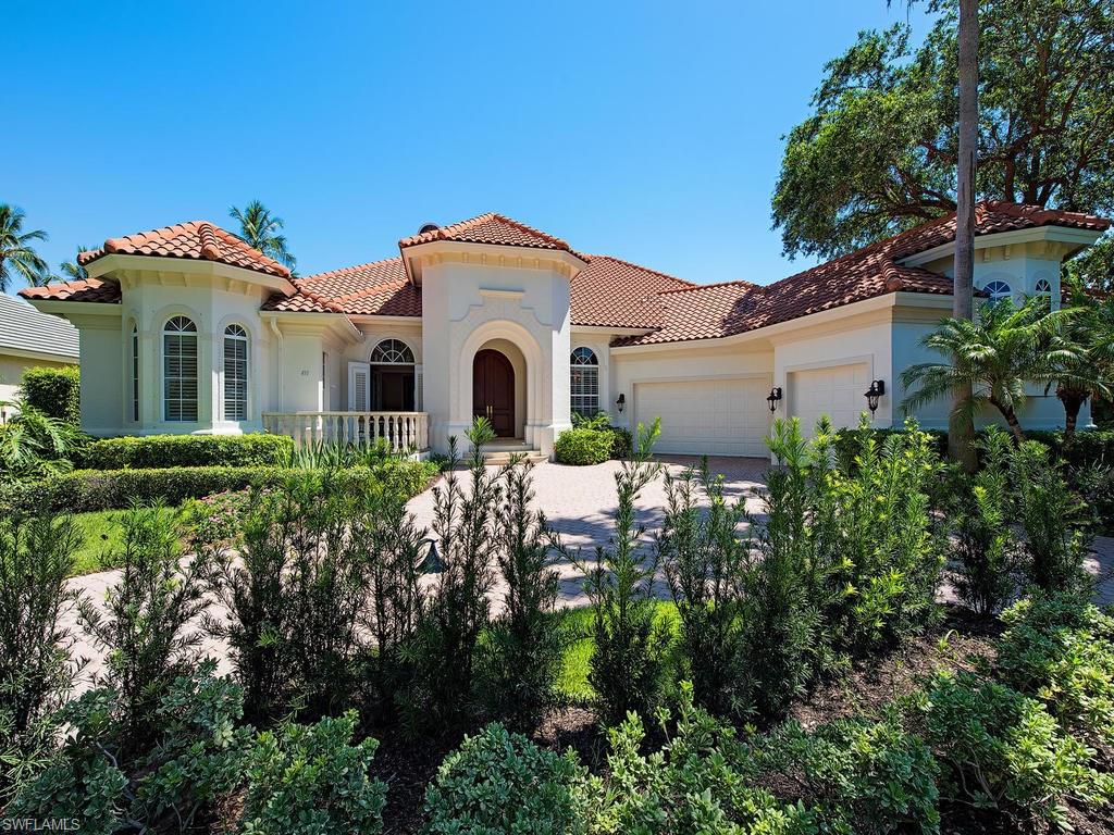 419 Mooring Line Drive Naples, FL 34102 - Photo 2 of 16 a front view of a house with a yard