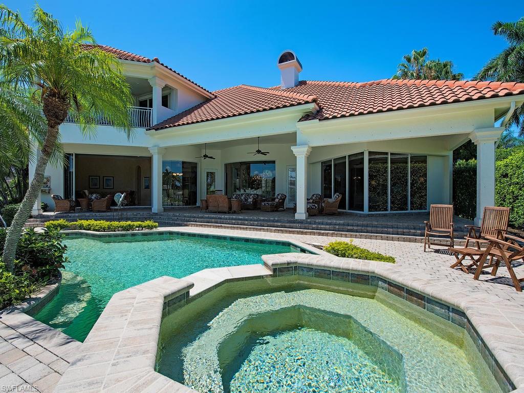 419 Mooring Line Drive Naples, FL 34102 - Photo 3 of 16 a view of a house with swimming pool and porch