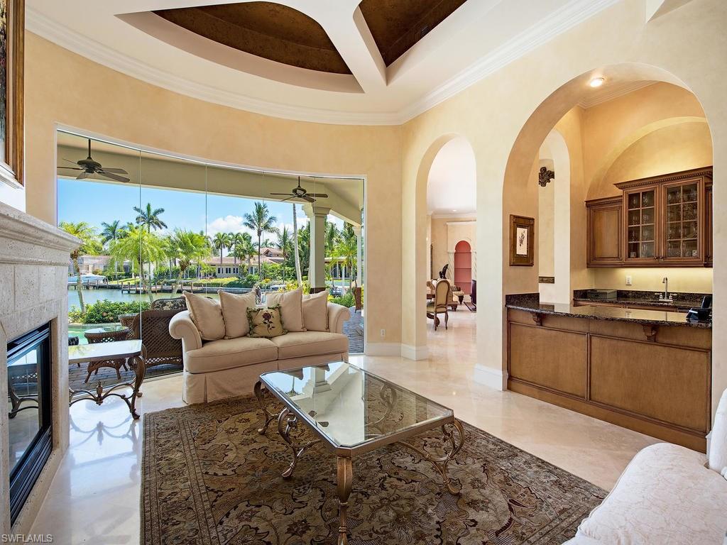 419 Mooring Line Drive Naples, FL 34102 - Photo 5 of 16 a living room with furniture and a large window