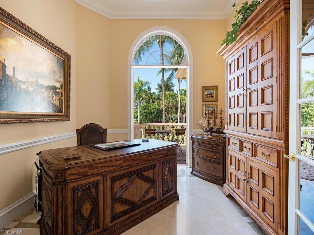 419 Mooring Line Drive Naples, FL 34102 - Photo 10 of 16 a view of a livingroom with furniture and staircase
