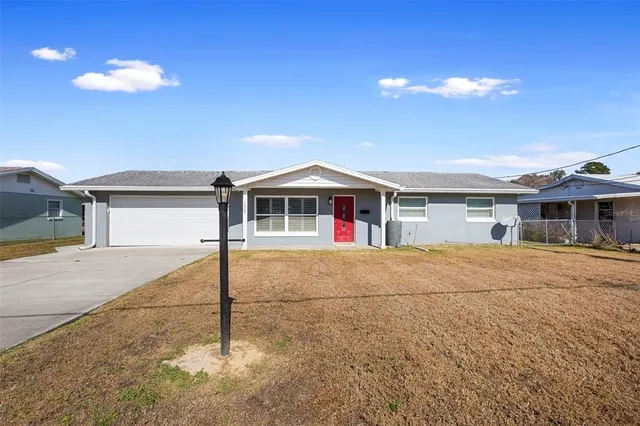 a front view of a house with a garage