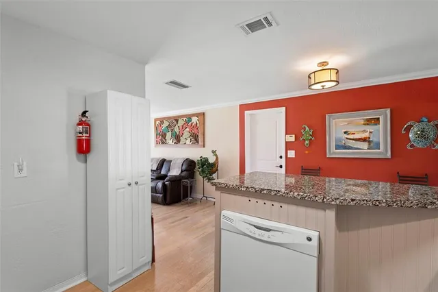 a view of a livingroom with furniture and gym equipment