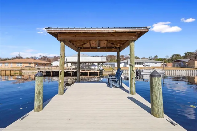 a view of a swimming pool with seating space