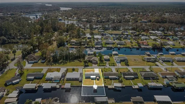 an aerial view of residential building with outdoor space and lake view