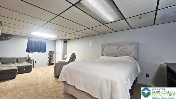 a bedroom with a bed and a shower