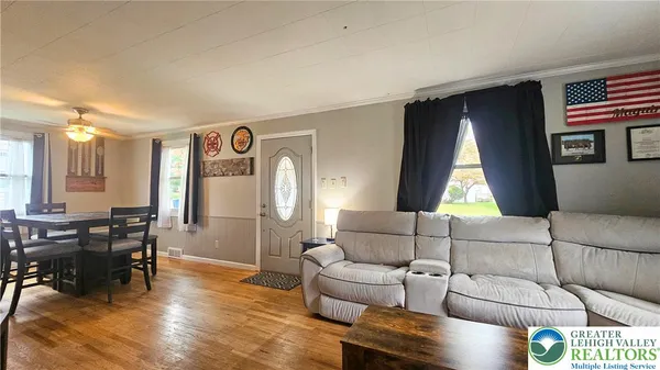 a living room with furniture and a window
