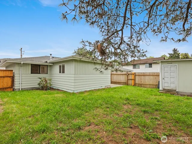 a backyard of a house with lots of green space