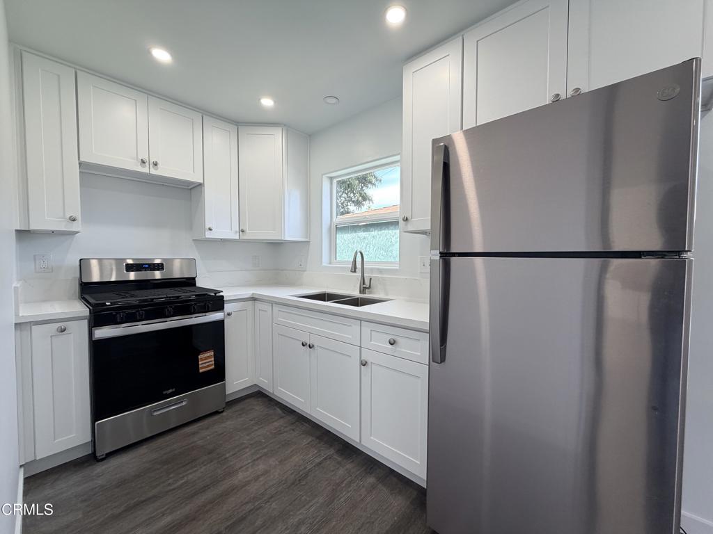 945 South H Street, Unit B Oxnard, CA 93030 - Photo 1 of 4 a white refrigerator freezer sitting in a kitchen