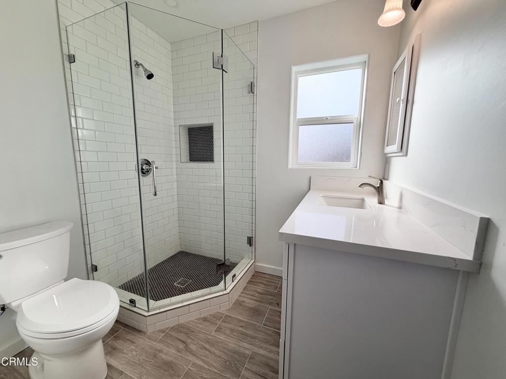 945 South H Street, Unit B Oxnard, CA 93030 - Photo 3 of 4 a bathroom with a sink toilet and shower