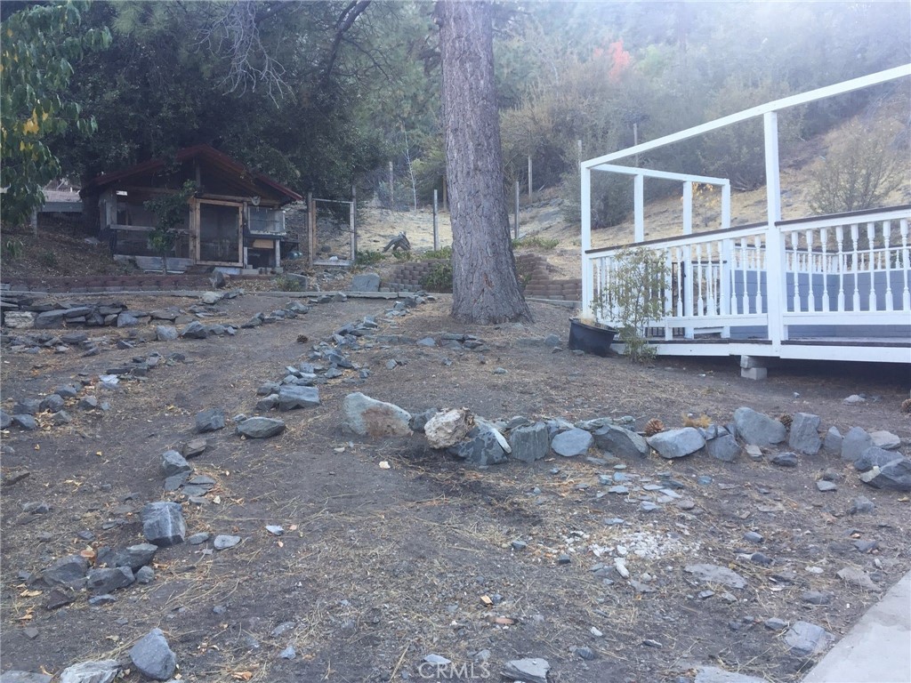 1792 Ash Road Wrightwood, CA 92397 - Photo 13 of 51 a view of a house with a yard and a wooden deck