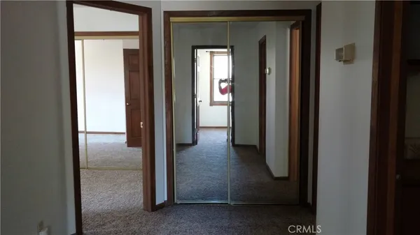 a view of a hallway with a glass door