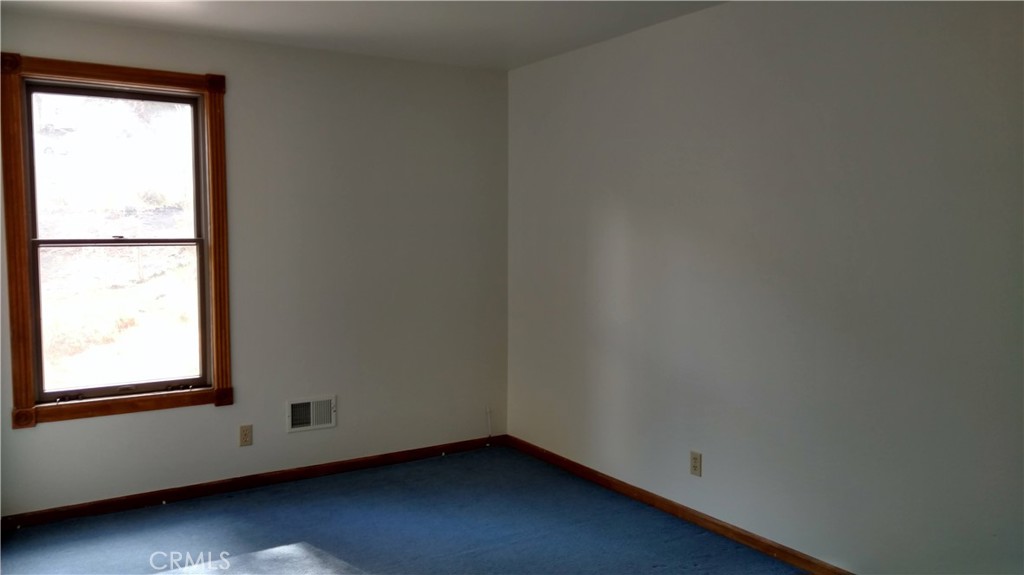 1792 Ash Road Wrightwood, CA 92397 - Photo 19 of 51 a view of an empty room and window