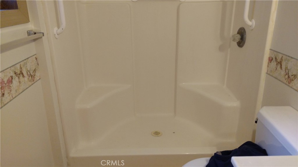 1792 Ash Road Wrightwood, CA 92397 - Photo 24 of 51 a bathroom with a bathtub and a toilet