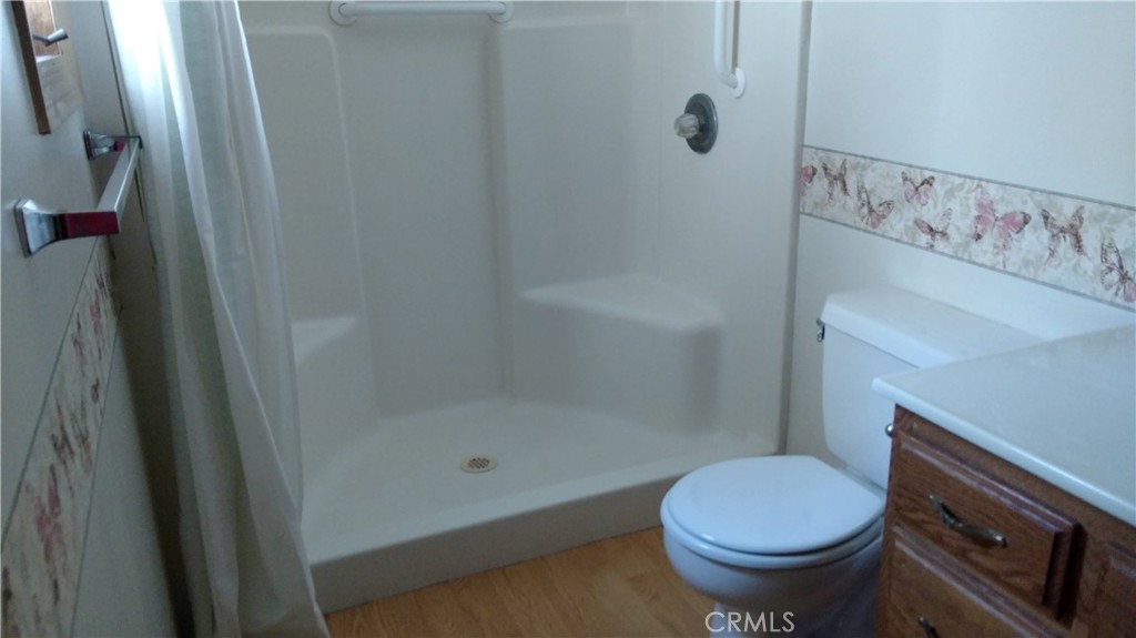 1792 Ash Road Wrightwood, CA 92397 - Photo 33 of 51 a bathroom with a sink a toilet a mirror and shower
