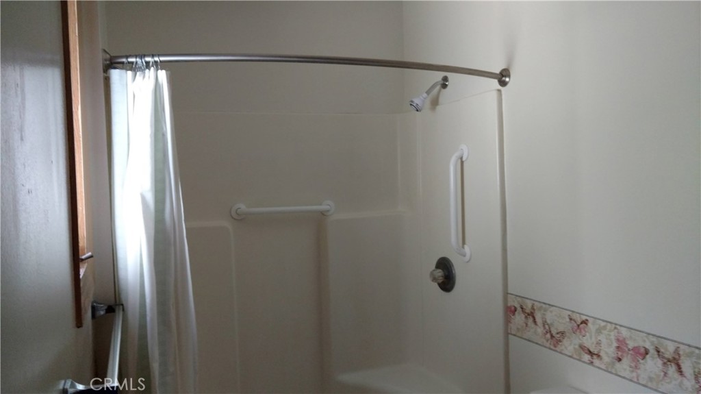 1792 Ash Road Wrightwood, CA 92397 - Photo 34 of 51 a bathroom with a glass shower door