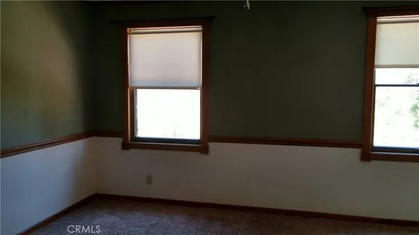 a view of walk in closet with a window