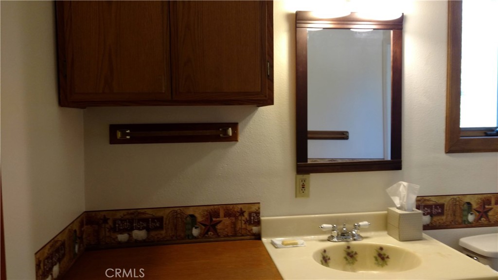 1792 Ash Road Wrightwood, CA 92397 - Photo 44 of 51 a bathroom with a sink and a mirror