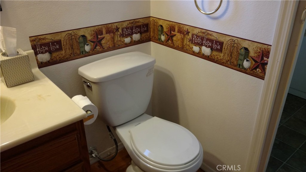 1792 Ash Road Wrightwood, CA 92397 - Photo 45 of 51 a bathroom with a toilet and a sink