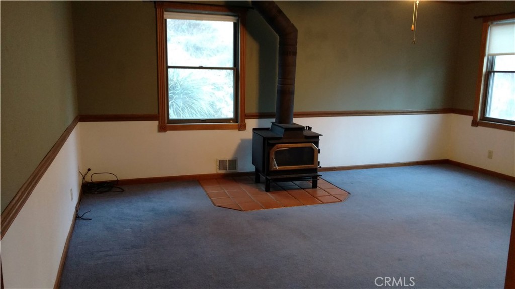 1792 Ash Road Wrightwood, CA 92397 - Photo 6 of 51 an empty room with windows