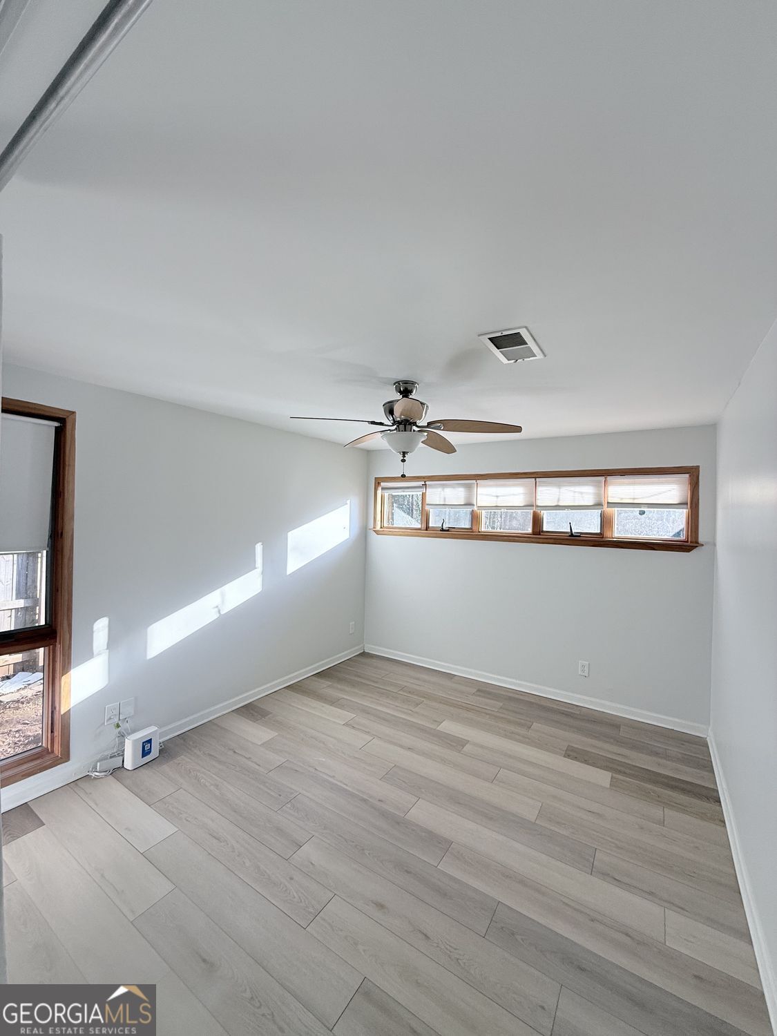 477 Benton Court Southwest Lawrenceville, GA 30044 - Photo 16 of 17 a view of a room with wooden floor