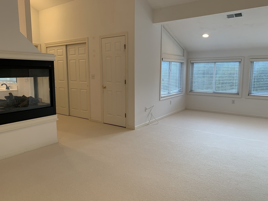 73 Half Crown Circle, Unit 73 Ashland, MA 01721 - Photo 12 of 18 a view of an empty room with a window