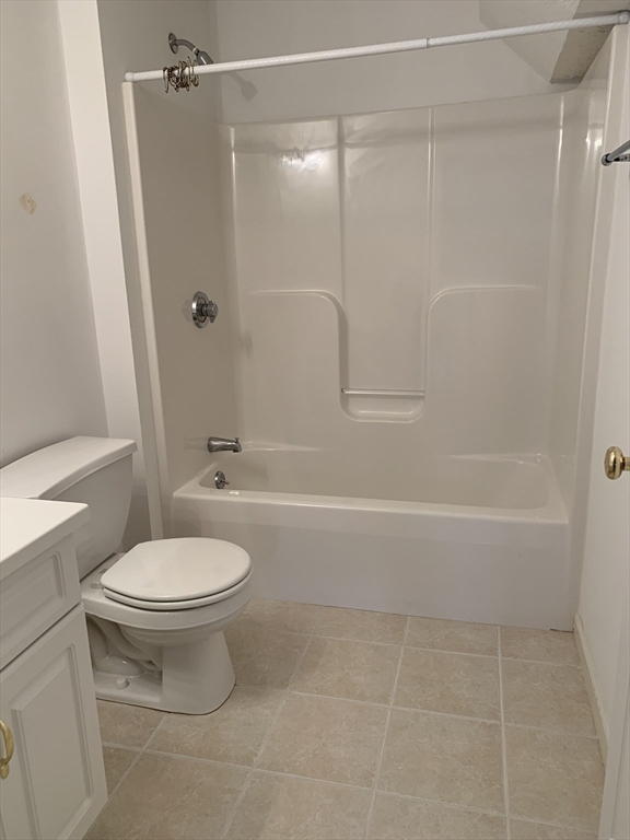 73 Half Crown Circle, Unit 73 Ashland, MA 01721 - Photo 18 of 18 a bathroom with a toilet and a shower