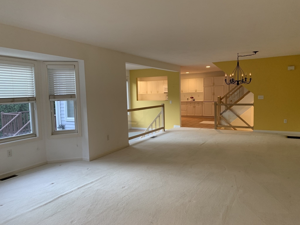 73 Half Crown Circle, Unit 73 Ashland, MA 01721 - Photo 3 of 18 a view of empty room with windows