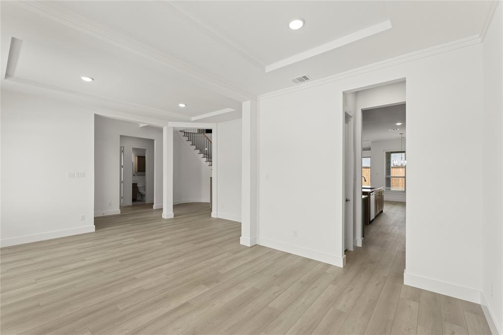 971 Georgetown Place Prosper, TX 75078 - Photo 12 of 34 a view of empty room with wooden floor