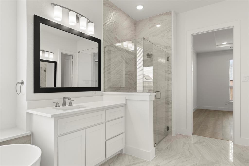 971 Georgetown Place Prosper, TX 75078 - Photo 25 of 34 a bathroom with a toilet a sink and mirror