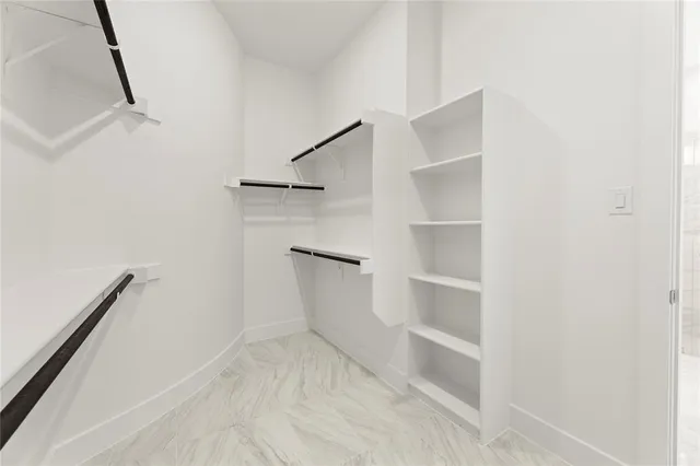 a view of an empty walk in closet