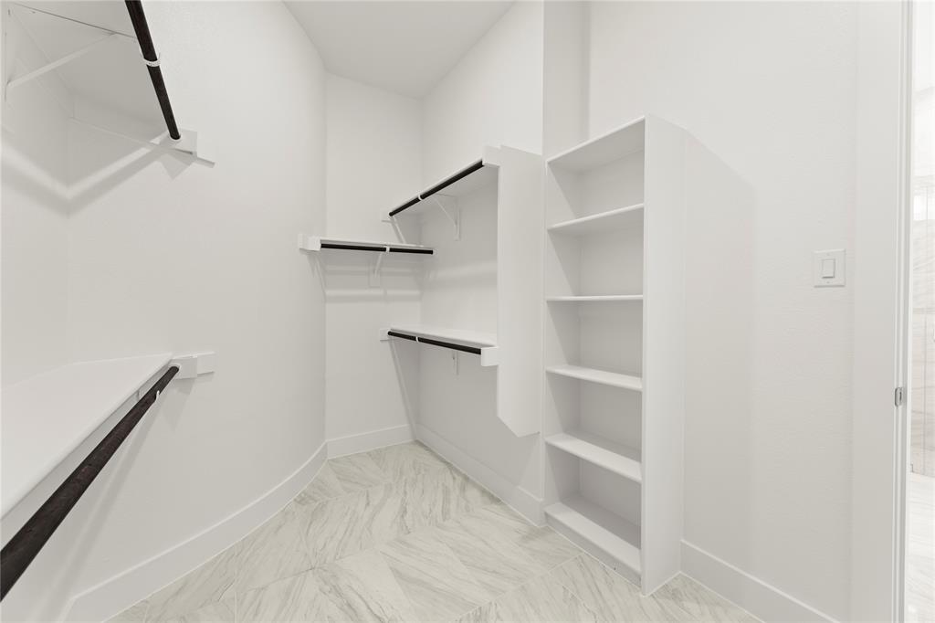 971 Georgetown Place Prosper, TX 75078 - Photo 27 of 34 a view of an empty walk in closet