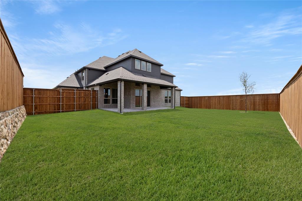971 Georgetown Place Prosper, TX 75078 - Photo 31 of 34 a front view of a house with garden