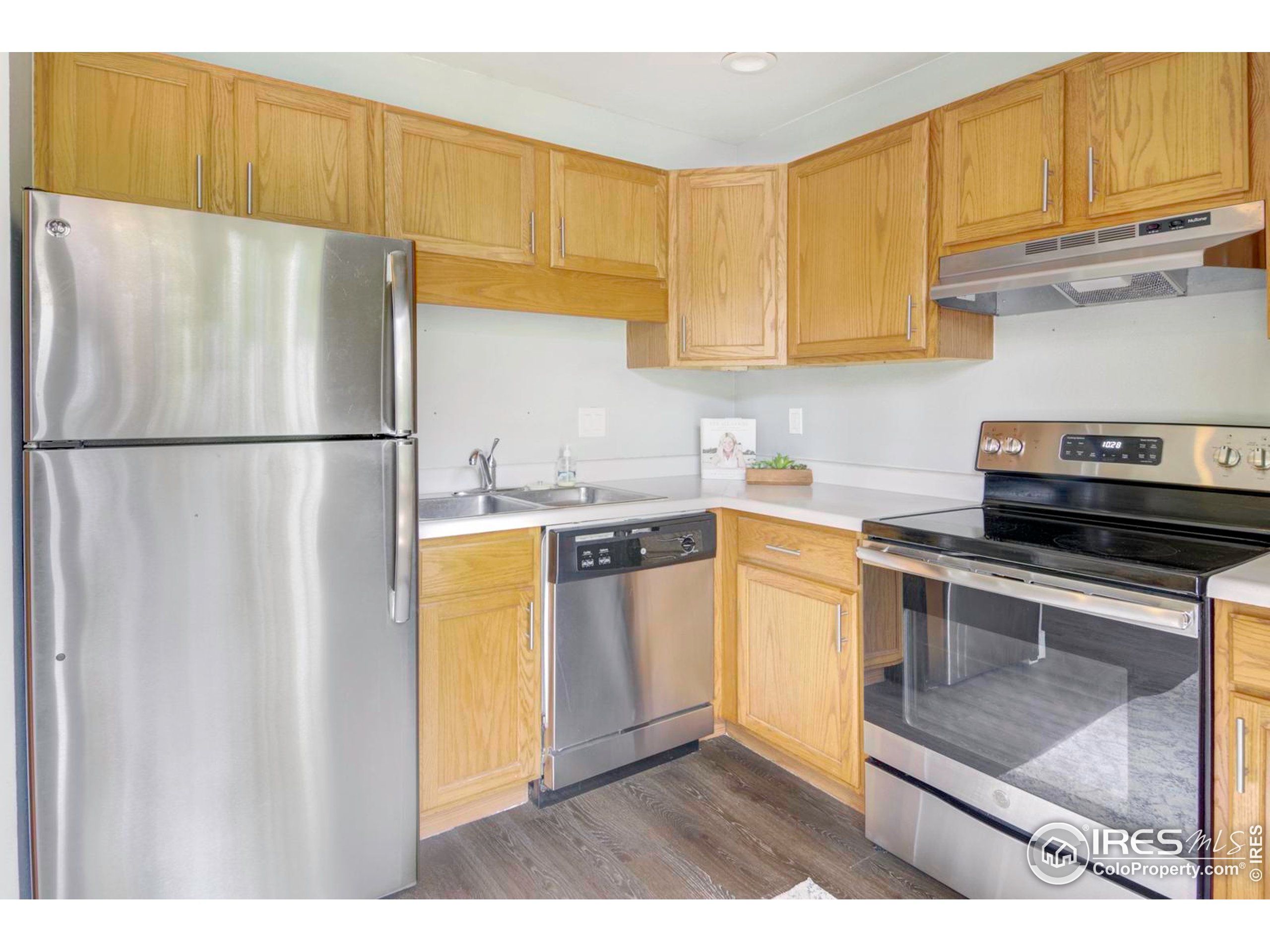 750 West Moorhead Circle, Unit A Boulder, CO 80305 - Photo 1 of 38 a kitchen with a refrigerator sink and cabinets