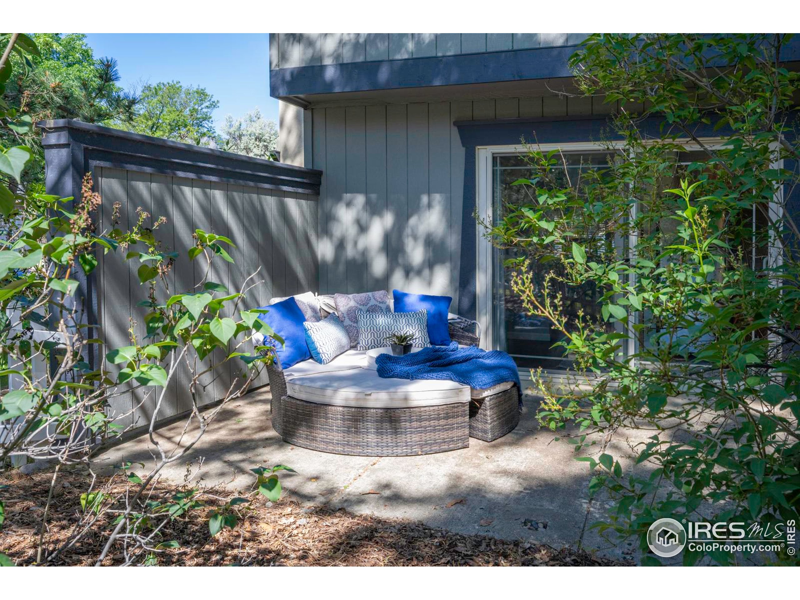 750 West Moorhead Circle, Unit A Boulder, CO 80305 - Photo 18 of 38 a view of a chair and table in the backyard with plants