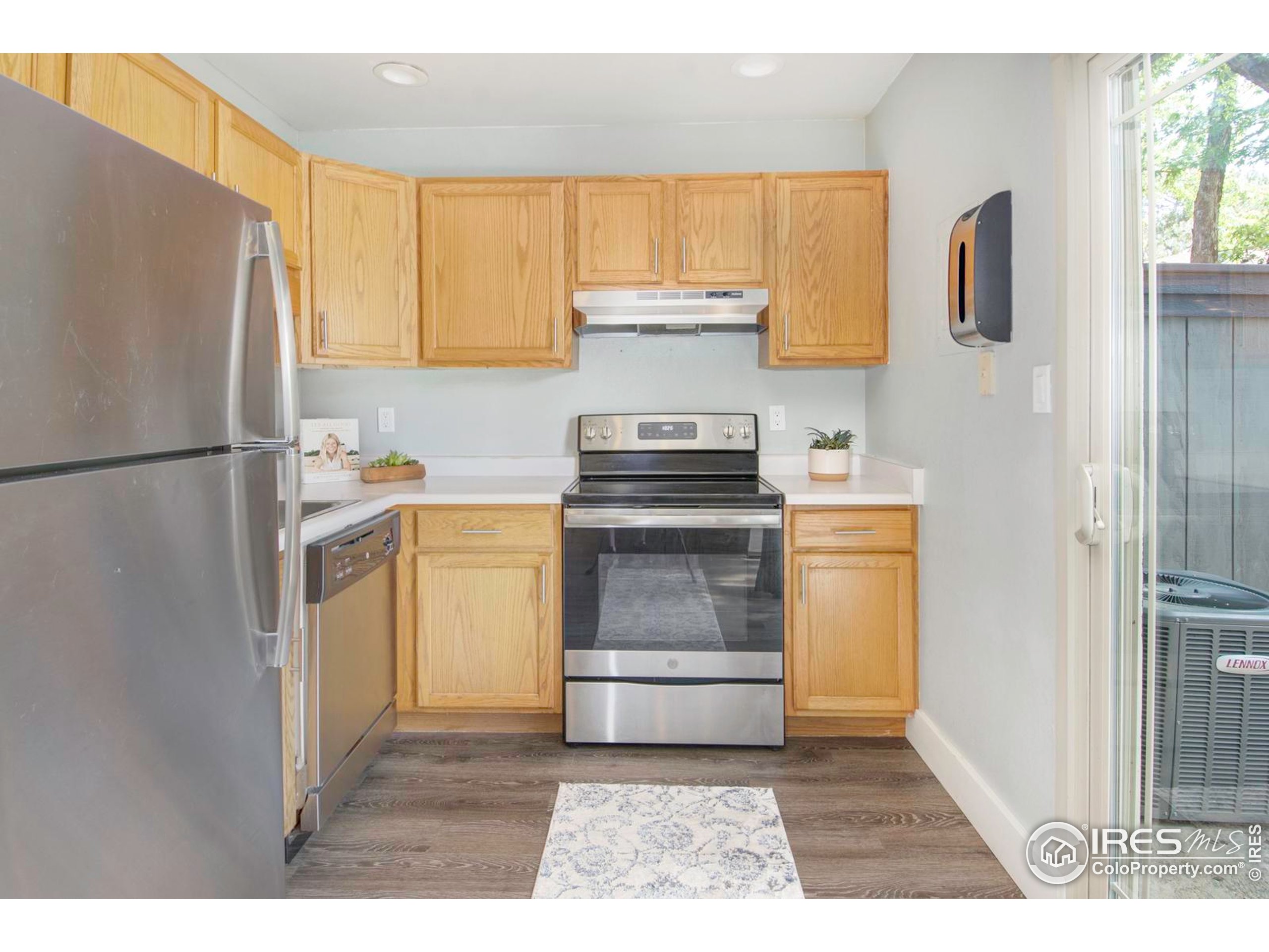 750 West Moorhead Circle, Unit A Boulder, CO 80305 - Photo 2 of 38 a kitchen with a refrigerator stove and sink