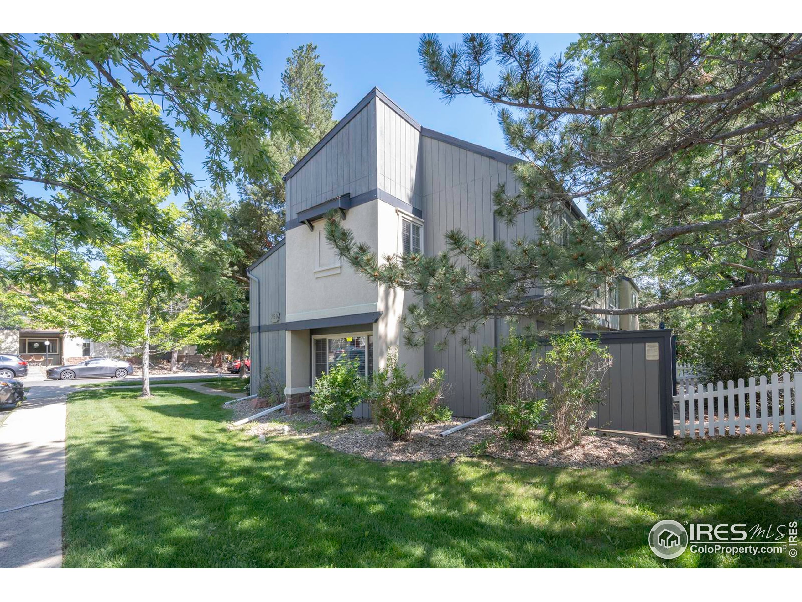 750 West Moorhead Circle, Unit A Boulder, CO 80305 - Photo 23 of 38 a view of a house with a yard and a garden