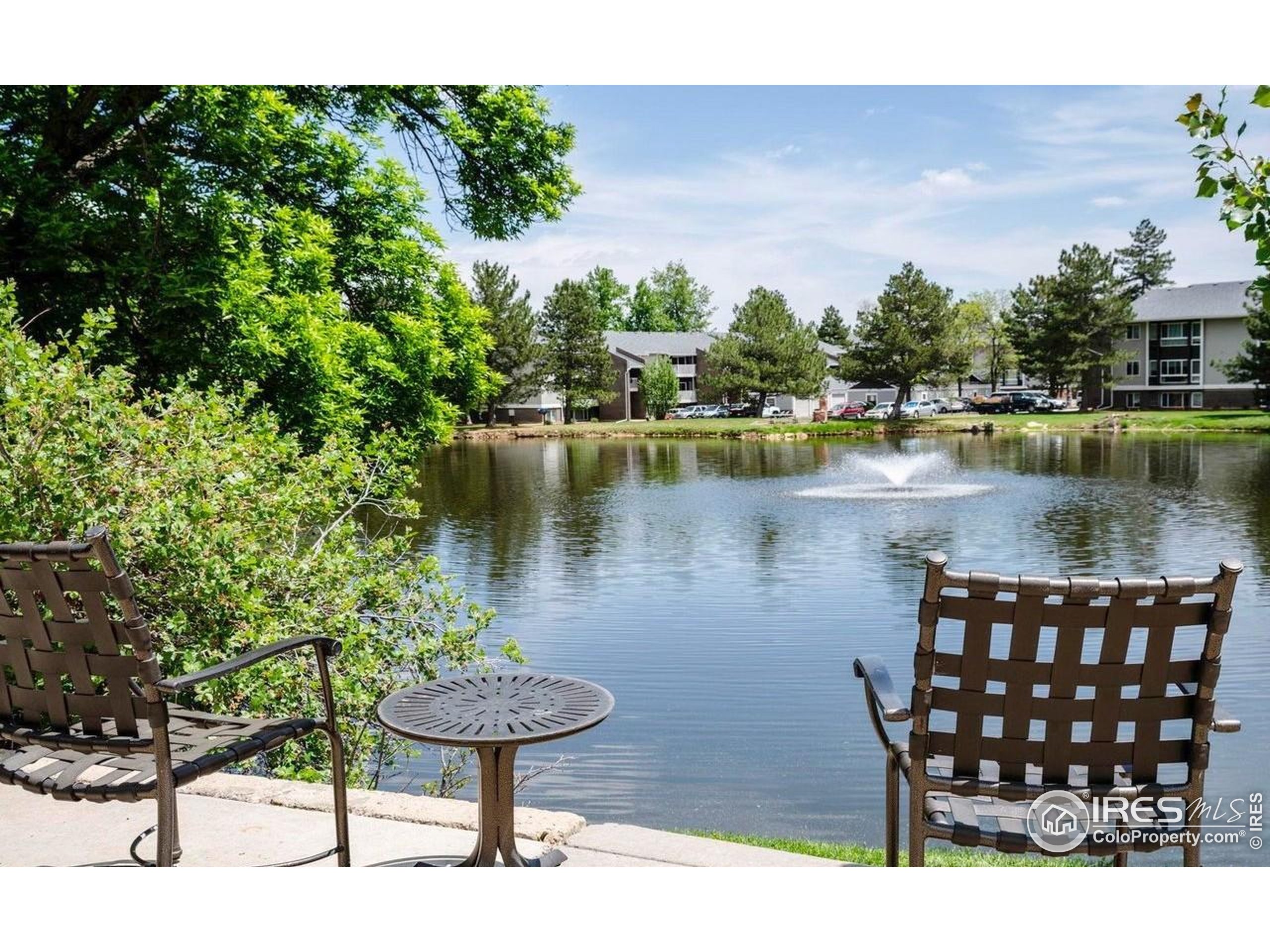750 West Moorhead Circle, Unit A Boulder, CO 80305 - Photo 32 of 38 a view of a lake with a table and chairs