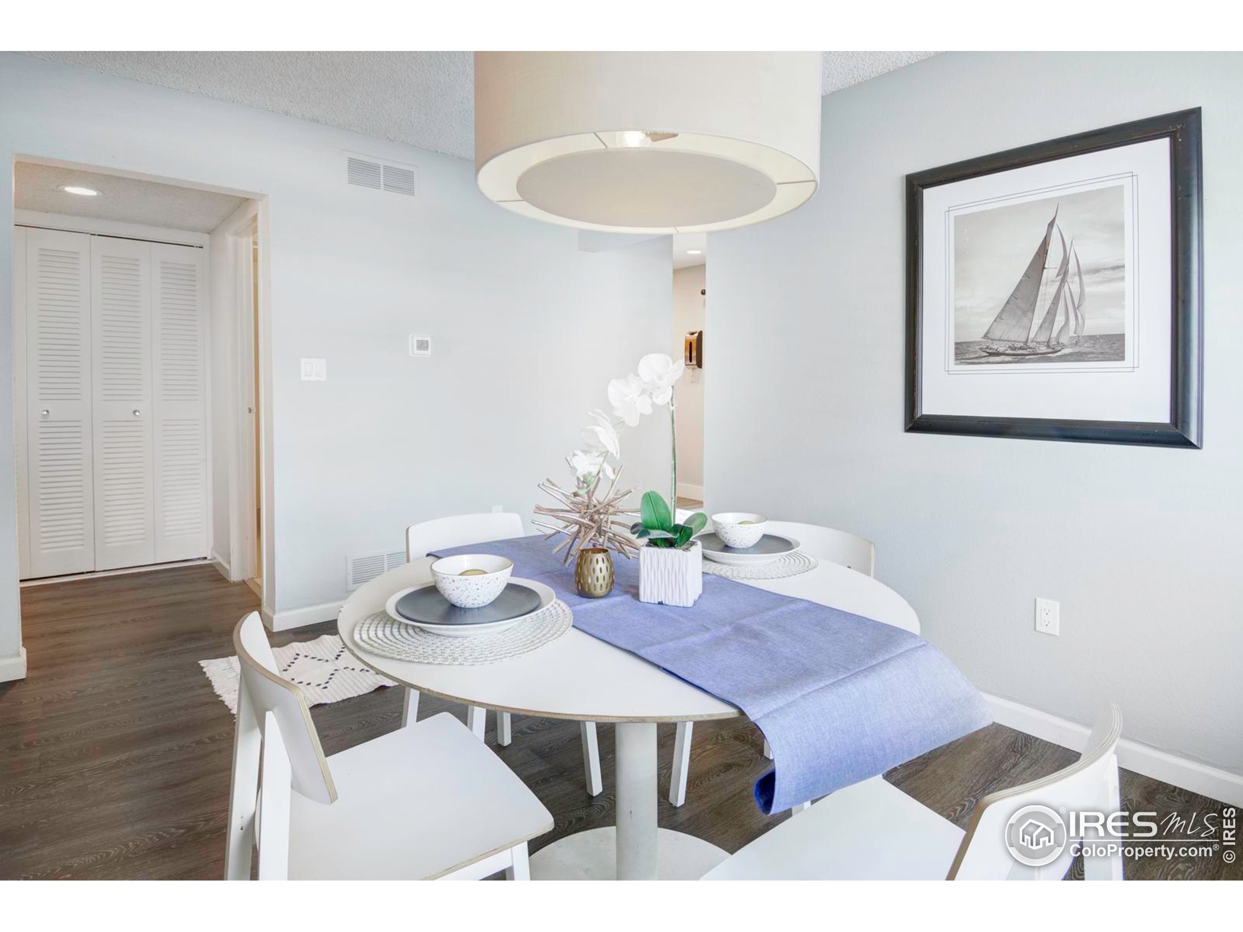 750 West Moorhead Circle, Unit A Boulder, CO 80305 - Photo 5 of 38 a view of a dining room with furniture and wooden floor
