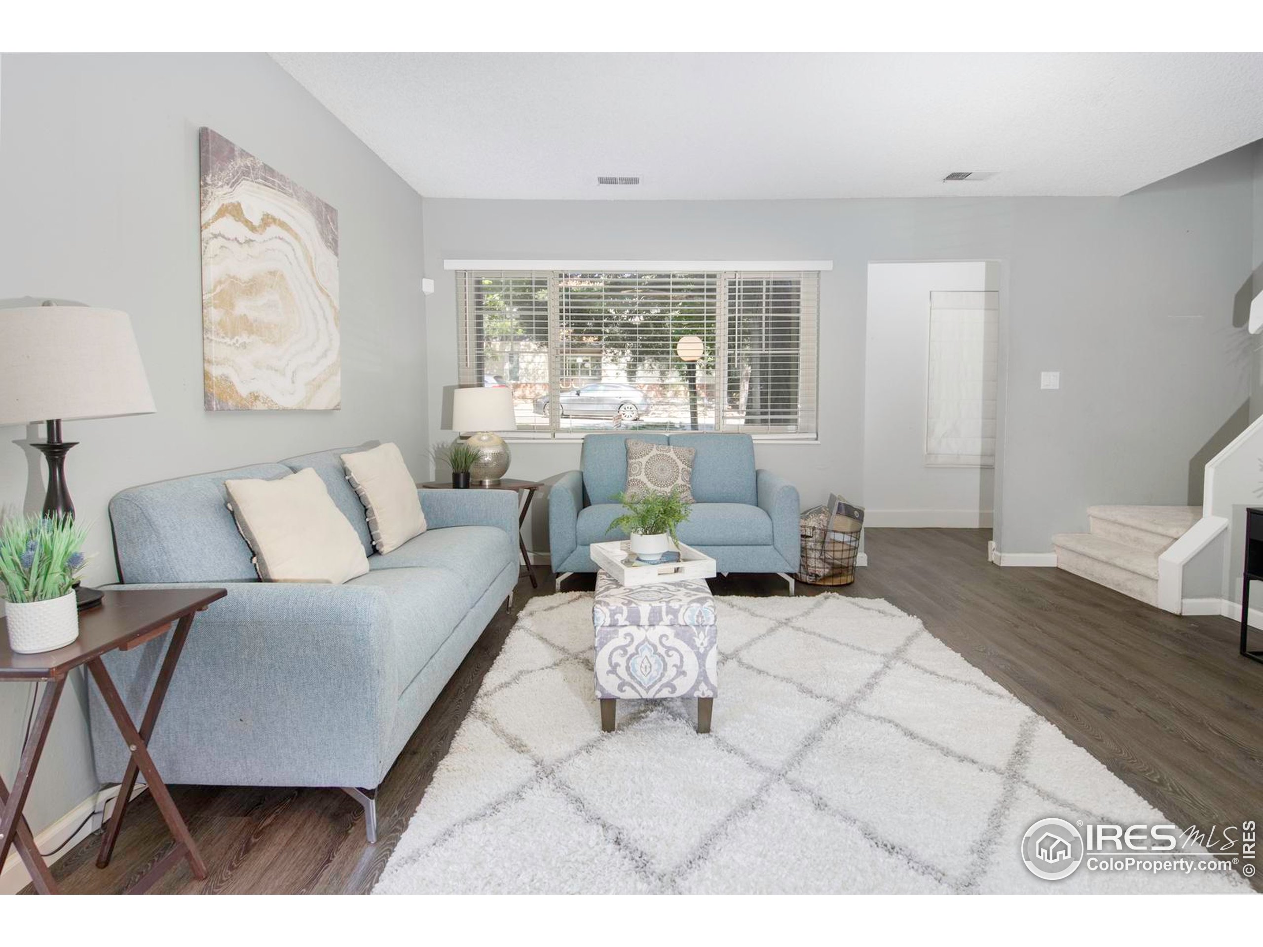 750 West Moorhead Circle, Unit A Boulder, CO 80305 - Photo 6 of 38 a living room with furniture and a large window