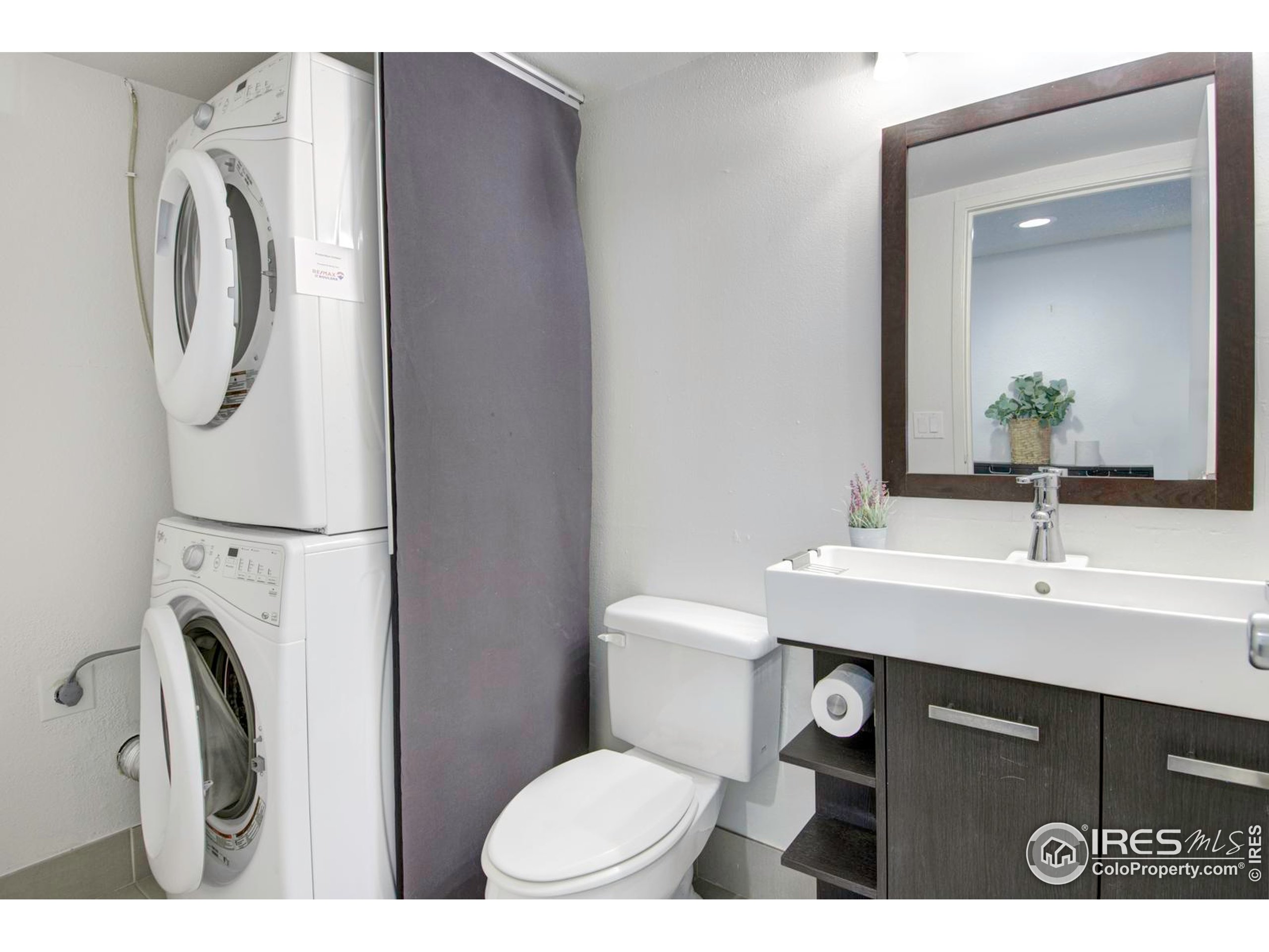 750 West Moorhead Circle, Unit A Boulder, CO 80305 - Photo 9 of 38 a bathroom with a sink a toilet and a mirror